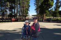 007-Kenny,Mommy_with_Old_Faithful_in_background-Upper_Geyser_Basin-early_for_parking_space