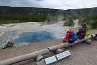 192-taking_a_break_viewing_Artemisia_Geyser-it_is_tempting_to_throw_a_rock_into_the_water