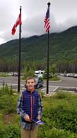 16-Kenny_with_US_and_Canadian_flag-he_has_his_junior_ranger_program