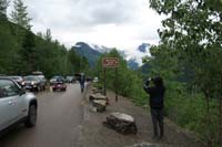 001-Going-to-the_Sun_Road_opened_today,Kenny_takes_photo_at_overlook