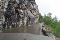 009-nice_little_waterfall_flowing_onto_the_wet_road