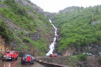 011-big_cascading_waterfall,historic_Red_Bus_Tours_vehicle_on_tour
