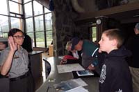 058-Kenny_takes_the_Junior_Ranger_Oath_at_Saint_Mary_Visitor_Center