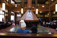 091-Mommy_and_Kenny_enjoying_the_fireplace_in_Many_Glacier_Lodge_lobby