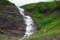 01-waterfall_and_mountain_bighorn_sheep-Going-to-the-Sun_Road