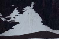 54-skiers_walking_up_steep_snow_bank