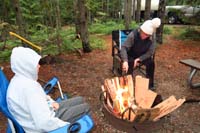 88-trying_to_start_a_fire_with_wet_wood-wood_and_boxes_drying_along_sides