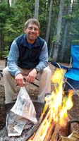90-Daddy_is_actually_drying_wet_newspaper_by_the_fire-first_fire_in_Glacier
