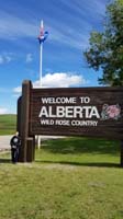 07-Welcome_to_Alberta_sign_with_Canadian_flag