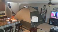 04-Mommy_set_up_a_tent_in_the_family_room_to_make_sure_it_is_okay_before_using_on_a_camping_trip