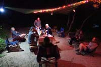 14-group_hangs_out_at_the_campsite_at_night