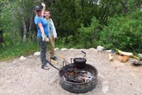 19-Mommy_and_her_famous_fabulous_pie_iron_pizza_over_a_campfire