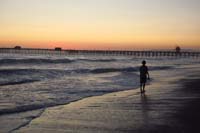 53-Kenny_walking_on_the_beach_at_sunset