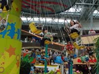 069-Kenny_and_Leyna_ride_the_swings