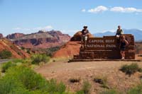 024-family_at_Capital_Reef_National_Park_entrance_sign