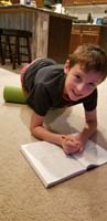 01-multitasking,rolling_out_his_quads_and_doing_vocabulary_homework