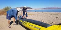 08-Daddy_and_Kenny_pumping_up_the_kayak_for_its_first_use_since_gift_from_last_Christmas