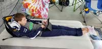 22-relaxing_at_basecamp_playing_on_his_tablet