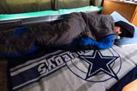 02-Kenny_sleeps_on_the_broken_down_table
