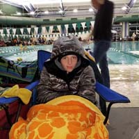75-Kenny_keeping_warm_since_flu_set_in_hard_between_prelims_and_finals,at_least_end_of_meet