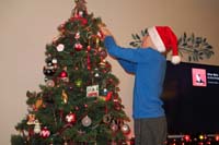 08-he_right_away_hangs_the_new_ornament_on_the_tree