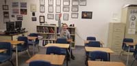 11-goofy_Kenny_acts_like_a_student_with_a_question_in_class-their_room_is_now_setup