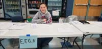12-Kenny_helps_everyone_register_for_the_caucus