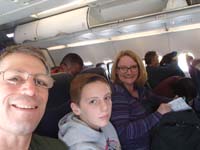01-family_on_the_plane-we_are_a_little_nervous_flying_with_a_world_pandemic_looming