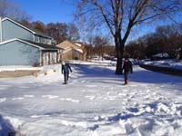 20-Brooke_and_Kenny_playing_in_the_snow_in_front_of_MN_Meyer_family_home