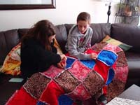 51-Leyna_and_Kenny_work_on_a_quilt_for_a_little_while