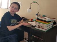 02-Kenny_proudly_introduces_his_'homework_pile'_he_enjoyed_getting_done