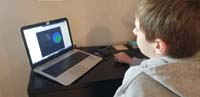 35-Kenny_works_on_programming_a_project_in_Scratch-game_based_on_plate_tectonics