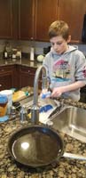 36-Kenny_must_do_at_least_one_thing_each_day_that_helps_the_family-washing_dishes_today