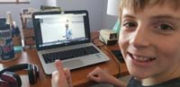 74-March_30-Kenny_is_very_happy_to_enjoy_math_vidoes_from_his_teacher_Mr._Ashley-online_learning