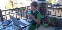85-enjoying_a_frozen_treat_while_watching_school_videos_in_the_afternoon