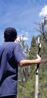 36-artistic_photo_of_Kenny_holding_walking_stick_looking_at_wavy_clouds
