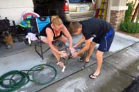 040-Kenny_helping_Mommy_give_Rainier_a_bath_outdoors-Rainier_is_a_good_boy,tolerated_it