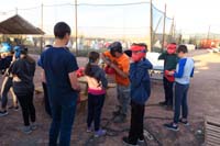 02-kids_putting_on_their_helmets-Kenny_to_right_in_green-Daddy_hopes_they_were_sanitized_beforehand