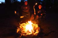 33-family_enjoying_the_fire-Kenny_creates_a_torch