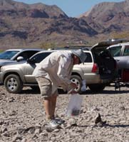 21-Daddy_picking_up_trash-currently_a_smelly_dog_poop_bag-from_Jen