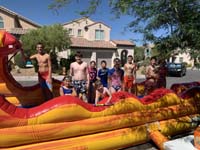 03-kids_having_fun_playing_on_water_slide,can't_wear_mask_with_water-being_careful-from_Julia