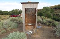 27-outhouse-system_is_to_place_seat_off_to_side_indicating_occupied_for_privacy