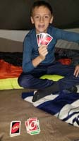 08-Kenny_plays_Uno_with_Mommy_in_the_tent