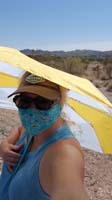 15-Mommy_all_masked_up_and_creative_way_to_hold_umbrella_for_shade