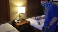 001-Daddy_sanitizing_the_hotel_room-pandemic_precautions-very_little_local_mask_use