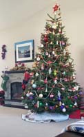 85-Mommy_is_very_happy_with_the_tree_and_fireplace_all_decorated_for_Christmas
