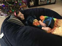 72-Kenny_relaxes_in_Benny_watching_vidoes_on_his_new_tablet_while_rolled_in_a_new_blanket-watching_South_Park