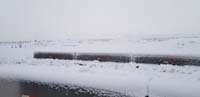 24-snow_covered_desert_behind_the_house-still_snowing-low_clouds_blocking_the_mountains