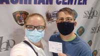 05-Mommy_and_Daddy_receive_their_first_COVID_vaccine_from_Cashman_Center_mass_vaccination_site