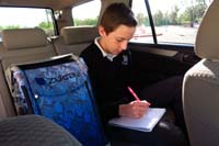 01-Kenny_studying_his_for_his_vocabulary_and_spelling_test_while_waiting_in_car_line